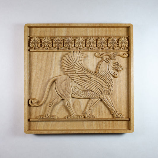 Front view of an Achaemenid winged lion wood relief with a Persian griffin design, carved details, decorative border, and natural wood finish.