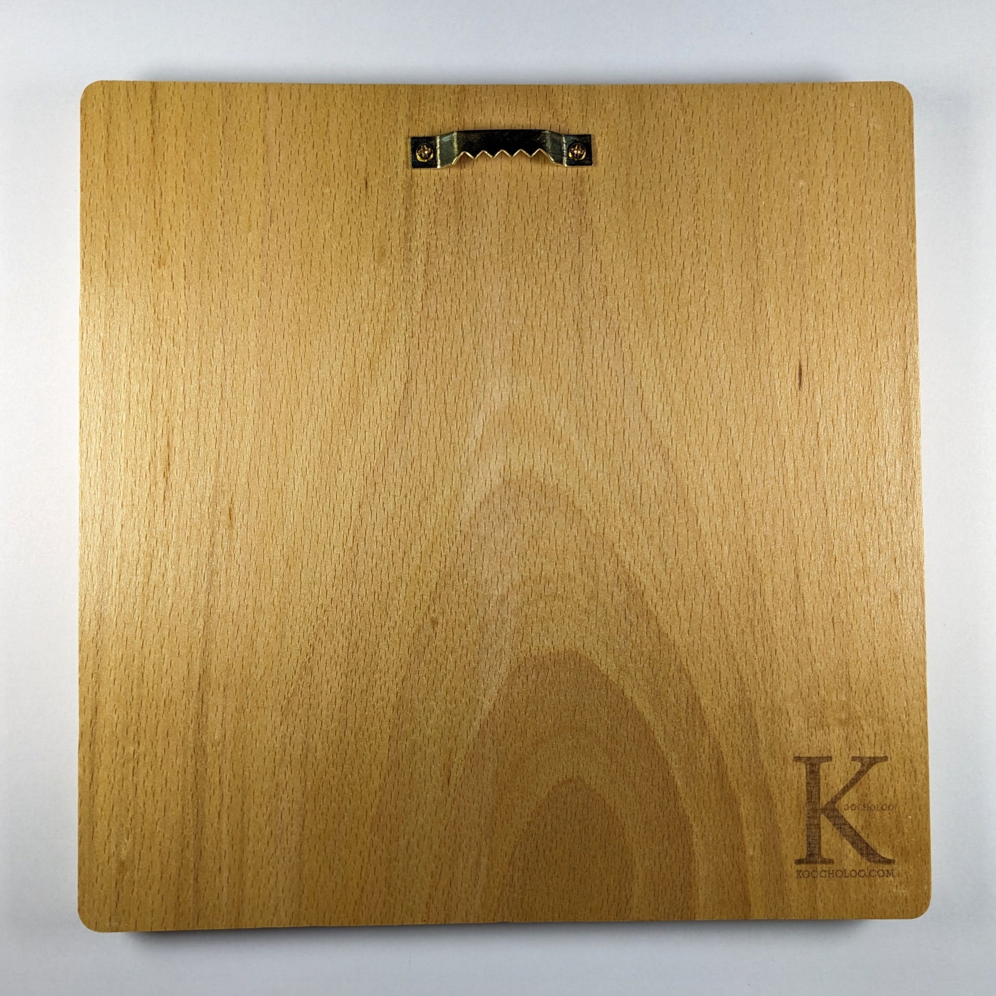 Back view of the Achaemenid Winged Lion Roundel showing natural beech wood grain, rounded corners, metal wall hanger, and engraved Koocholoo logo with Koocholoo.com.