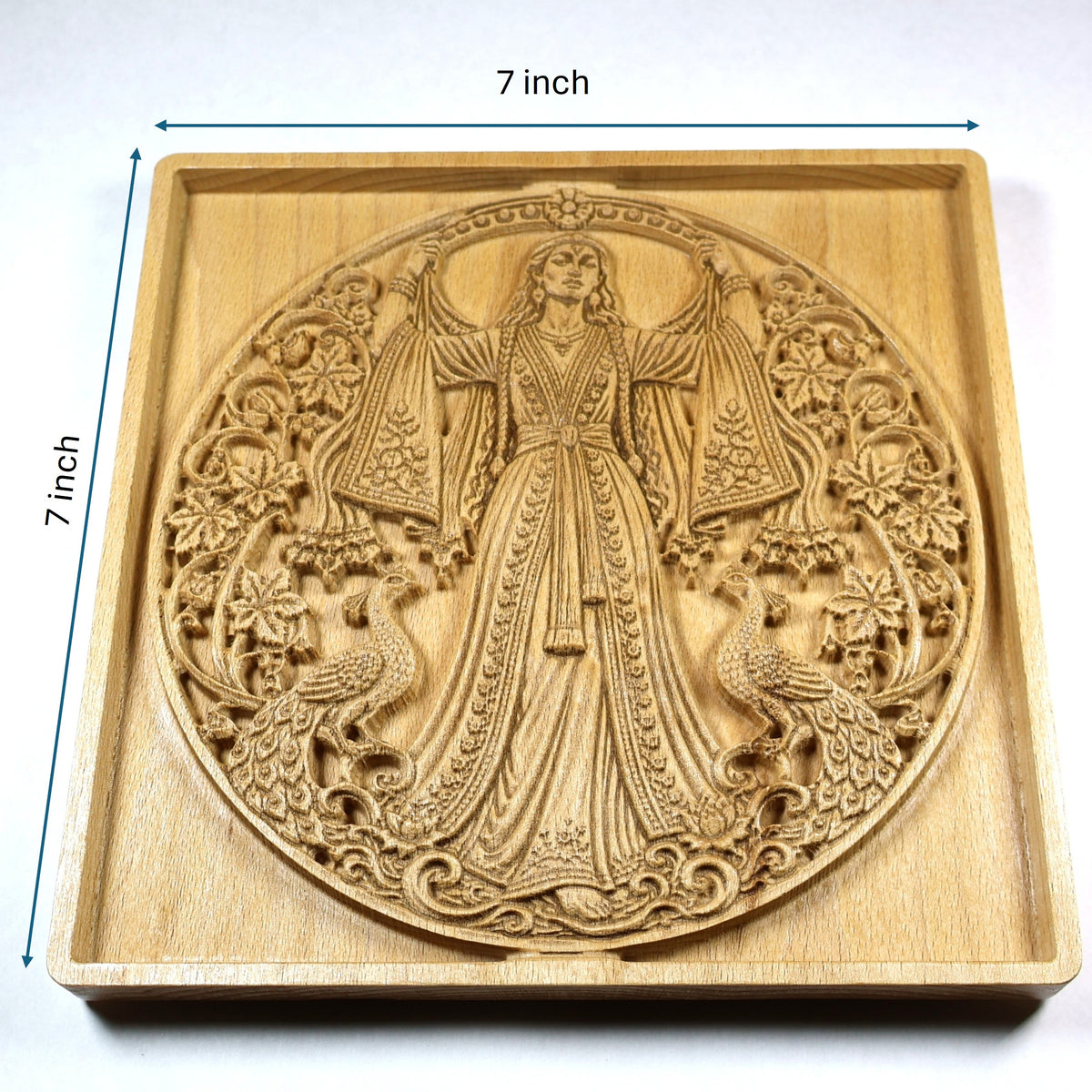 7 by 7 inch Anahita wood relief size guide showing the Persian goddess, peacocks, floral details, square frame, and natural wood finish.