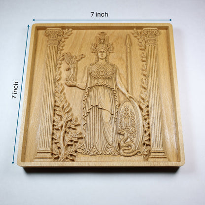 Athena wood relief with 7 inch width and height markers, showing the Greek goddess carving, square frame, and natural wood finish.