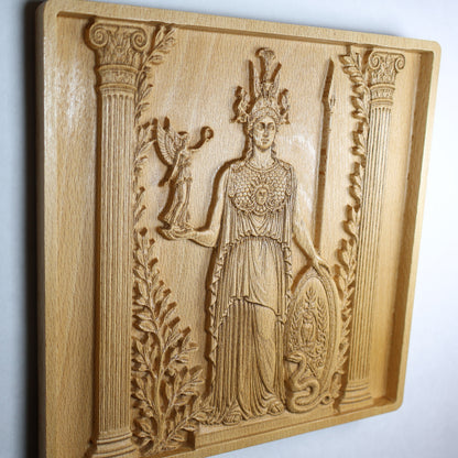 Angled Athena relief showing the Greek goddess of wisdom with warrior details, carved symbols, and warm natural wood grain.