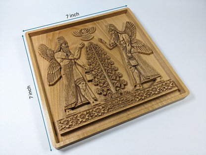 Size reference for Assyrian Sacred Tree beech wood wall art showing 7 inch by 7 inch square carved plaque with mirrored Apkallu guardian figures, central tree of life, Ashur winged disc, floral border frieze, recessed frame, and visible plaque thickness