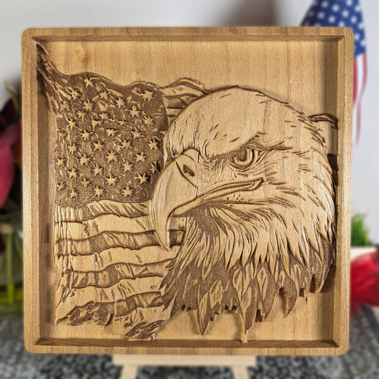 Wooden plaque with engraved American flag and bald eagle