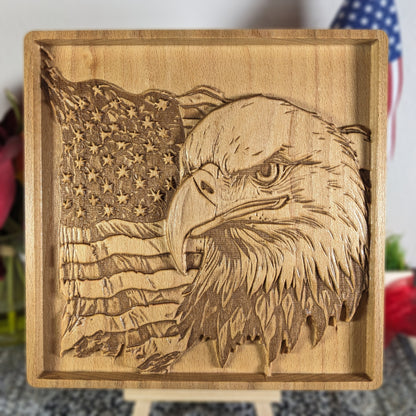 Wooden plaque with engraved American flag and bald eagle
