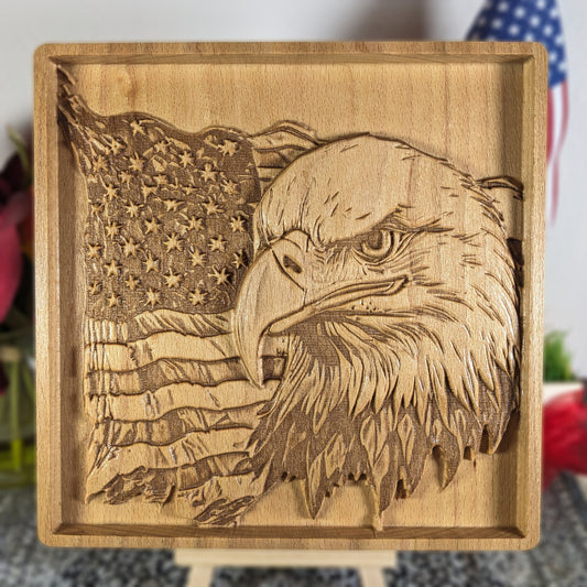 Wooden plaque with engraved American flag and bald eagle