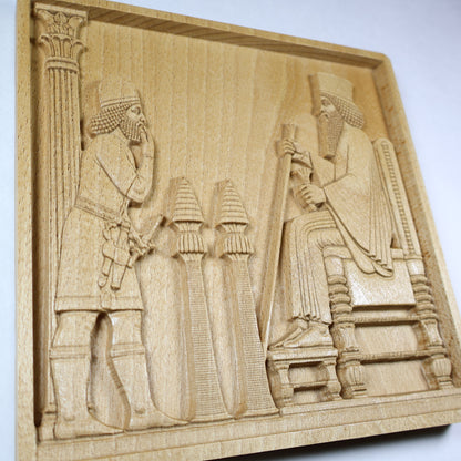Angled close-up of the Persepolis Royal Audience wood relief showing King Darius on a throne, an approaching figure, palace column, ceremonial stands, and natural beech wood finish.