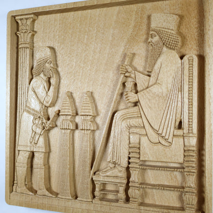 Side display view of the Persepolis Royal Audience wood relief showing the seated king, attendant figure, palace column, ceremonial objects, raised carving depth, and natural beech wood finish.