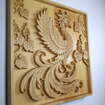 Left side display view of a Japanese Phoenix wood relief showing the raised wing, flowing tail, paulownia branches, and natural wood finish.