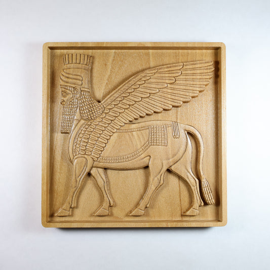 Front view of Lamassu Assyrian guardian carved wood relief, winged bull with human head, CNC-carved solid beech wood, 3D bas relief wall art, ancient Mesopotamian home decor.