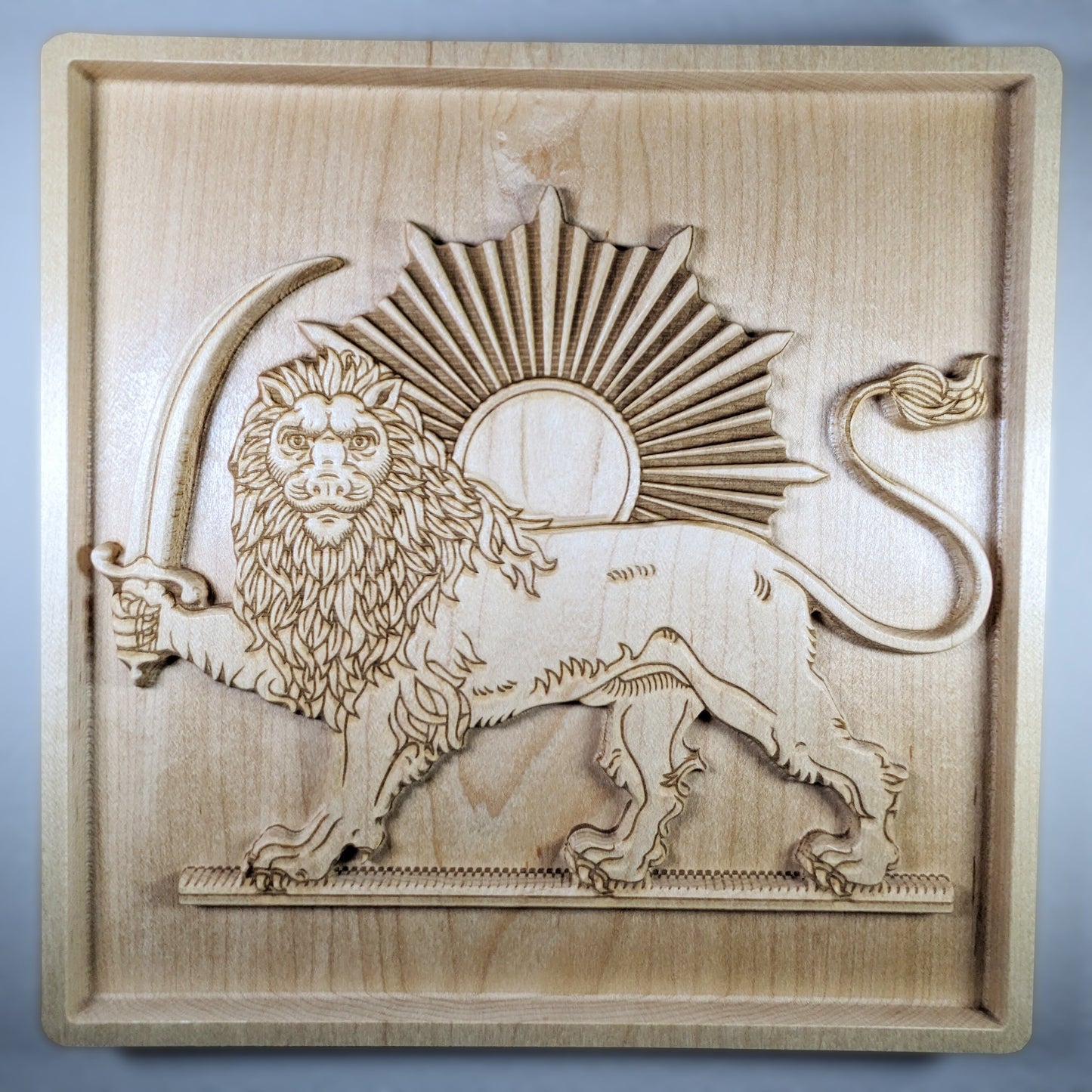 Close-up of hand-carved hard maple wood relief of the Lion and Sun (Shir va Khorshid), showing raised lion figure, curved saber, sunburst rays, and fine laser-engraved detail, Persian 3D wall art