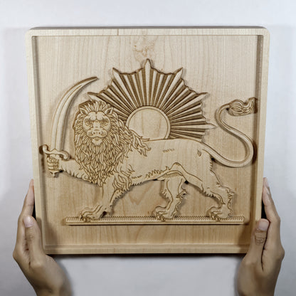 Person holding Lion and Sun (Shir va Khorshid) hard maple wood relief with both hands, showing full 11 inch carved panel size, raised lion figure, sunburst, and 3D relief depth, Persian wall art size reference