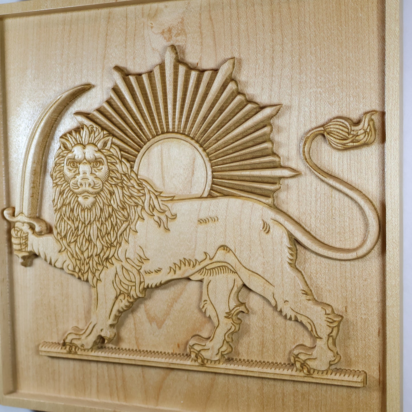 Detailed Lion and Sun wood relief showing the crowned lion, textured mane, sword, radiant sun, and fine carved linework.
