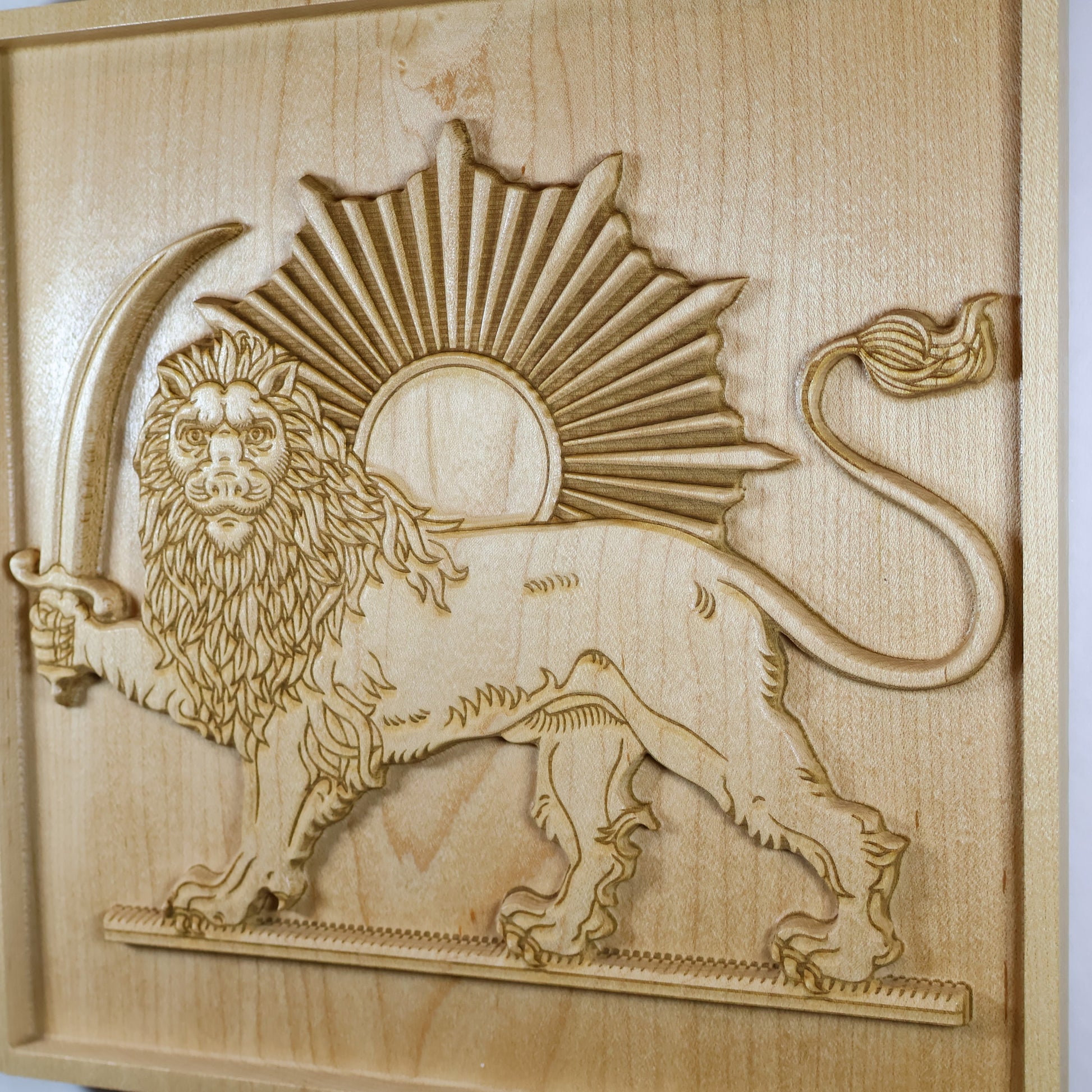 Detailed Lion and Sun wood relief showing the crowned lion, textured mane, sword, radiant sun, and fine carved linework.