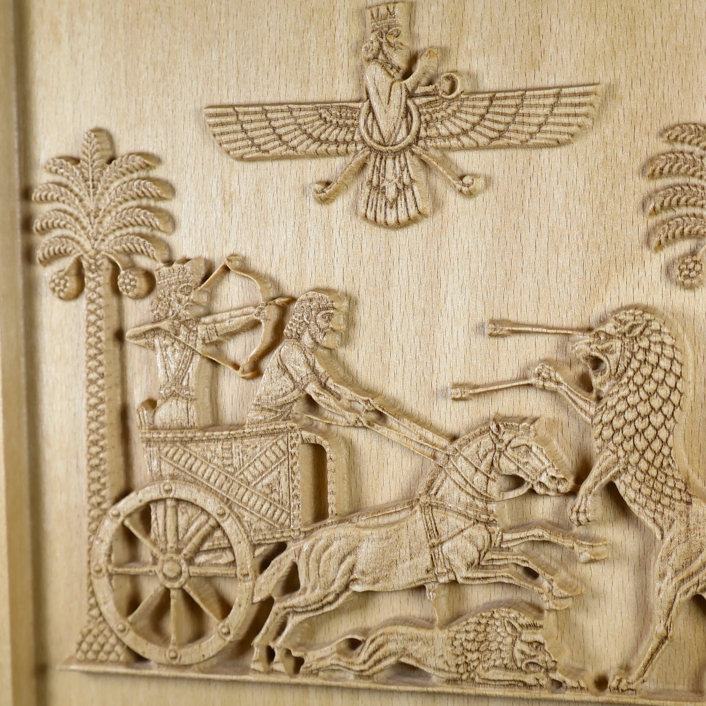 Detailed view of the Achaemenid hunting scene showing the king, bowman, driver, horses, lions, date palms, and winged symbol.