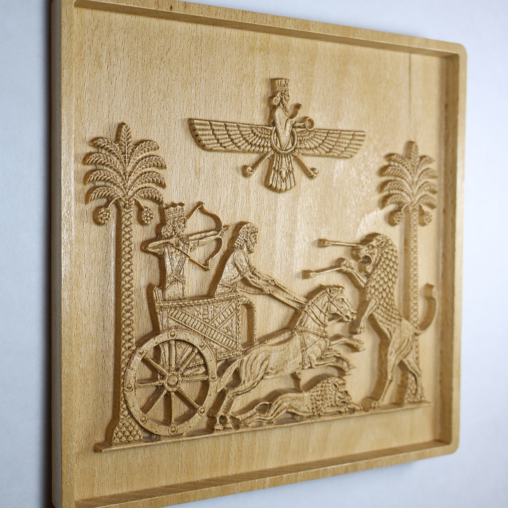 Side view of the Darius wood relief showing the panel edge, raised carving depth, chariot, horses, lion, and recessed frame.
