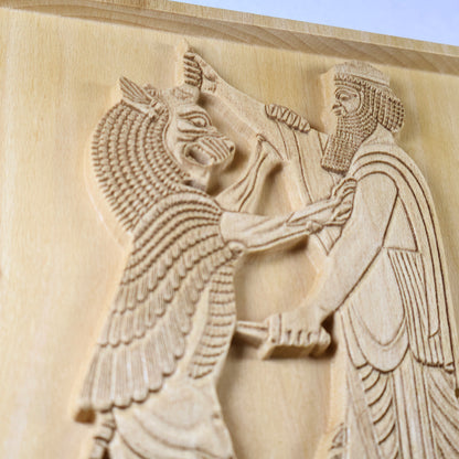 Macro side view of Shahriar and the Lion wood relief showing the carved lion, Persian figure, dagger, beard detail, robe lines, and raised natural wood relief.