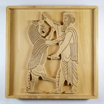 Straight-on view of Shahriar and the Lion wood relief, showing the centered Persian figure and rearing lion with carved robe, beard, mane, and natural wood finish.