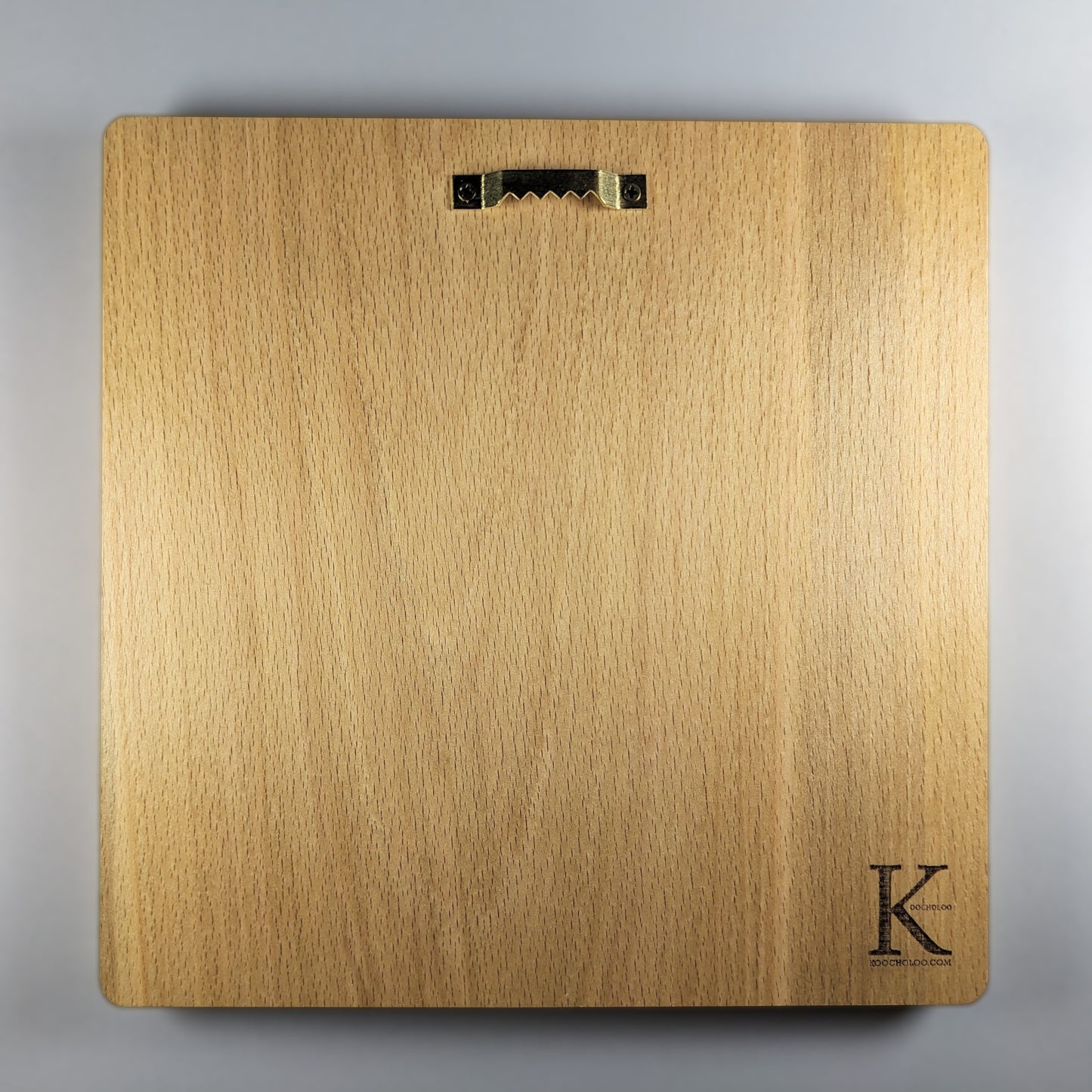 Back view of Lion and Sun wood wall art carved in solid beech, showing smooth natural wood grain, rounded corners, installed metal sawtooth hanger, finished back panel, and small Koocholoo maker mark for wall display.