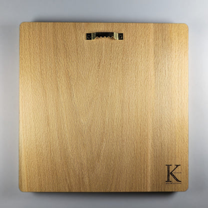 Back view of Lion and Sun wood wall art carved in solid beech, showing smooth natural wood grain, rounded corners, installed metal sawtooth hanger, finished back panel, and small Koocholoo maker mark for wall display.