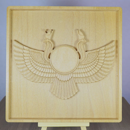 Rotating tabletop video of an Egyptian Winged Sun Disk wood relief, showing the front and angled side views of the carved Ra-Horus sun symbol, wide feathered wings, twin uraeus cobras, raised bas relief depth, and natural beech wood finish.