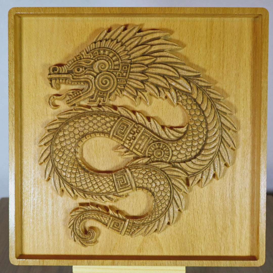 Video of Quetzalcoatl 7 inch beech wood relief rotating to show carved 3D depth, intricate feathered serpent scales, spiral motifs, and fine CNC detail, Aztec wood wall art craftsmanship
