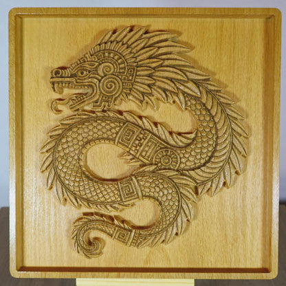 Video of Quetzalcoatl 7 inch beech wood relief rotating to show carved 3D depth, intricate feathered serpent scales, spiral motifs, and fine CNC detail, Aztec wood wall art craftsmanship