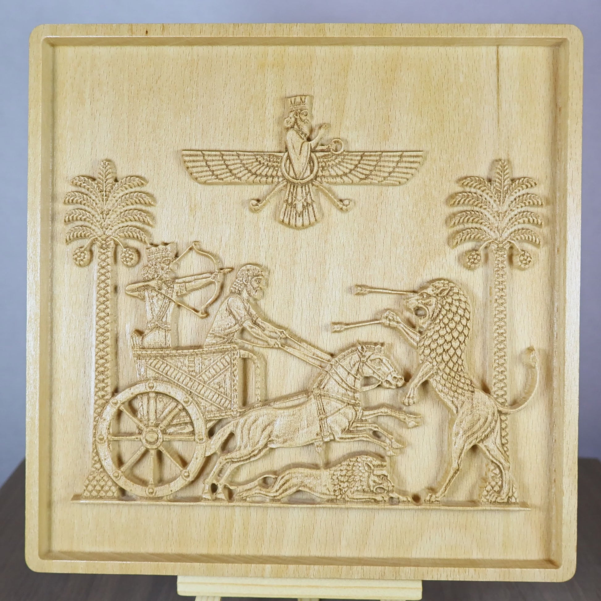 Rotating tabletop video of the Royal Seal of Darius wood relief, showing the front and angled side views of the Achaemenid lion hunt, royal chariot, horses, palm trees, layered carving depth, and natural beech wood finish.