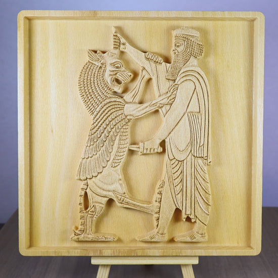 Rotating tabletop video of the Shahriar and the Lion wood relief, showing the front and angled side views of the Achaemenid-inspired Persian figure, lion scene, carved clothing and weapon details, raised relief depth, and natural beech wood finish.