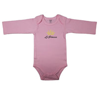 Spanish baby bodysuit with golden princess crown. Pink baby girl clothes with the words "La Princesa". Pink long sleeve baby bodysuit with the words "The Princess" in Spanish.