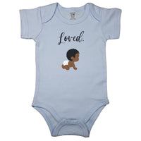 Baby blue baby bodysuit with "Loved." in cursive and a drawing of a cute curly haired baby in diapers.