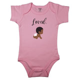 Pink baby bodysuit with "Loved." in cursive and a drawing of a cute curly haired baby in diapers.