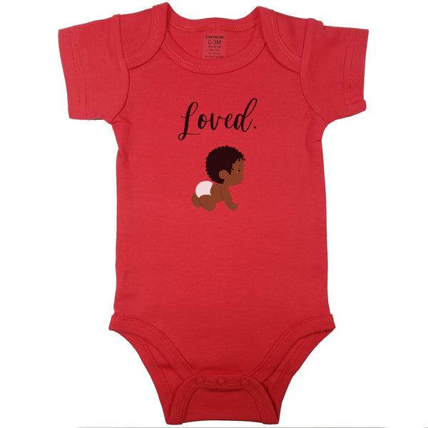 Red baby bodysuit with "Loved." in cursive and a drawing of a cute curly haired baby in diapers.